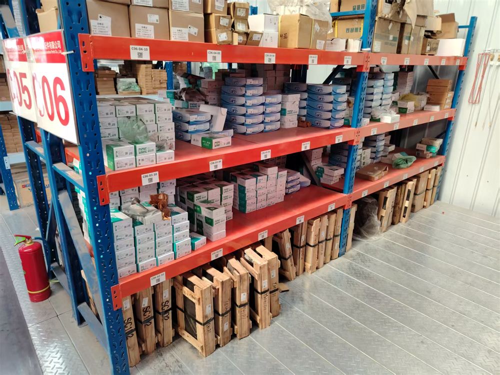 Engine parts shelving with labelled boxes